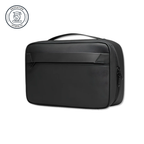 Compact black toiletry bag with handle and zippered compartments for organized travel essentials