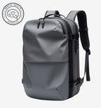 Astrava SE gray backpack with vacuum compression, water-resistant shell, TSA lock, and USB charging port.