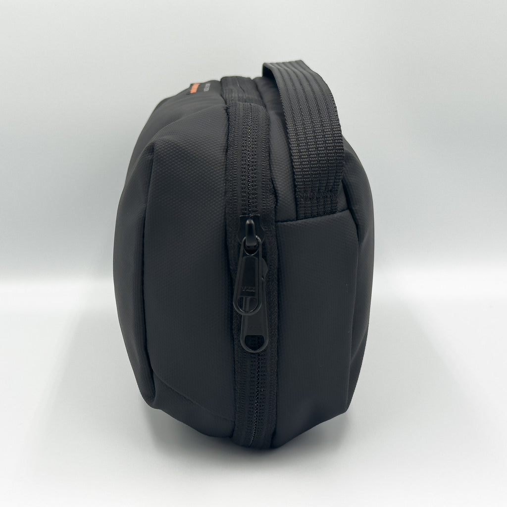 Compact black ESSENTIA Bag water-resistant travel organizer with zipper and handle for tech and essentials