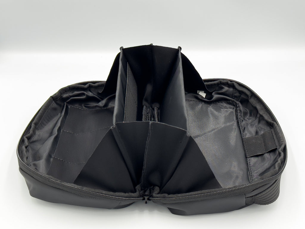 Black ESSENTIA Bag travel organizer with multiple compartments, water-resistant and lightweight design for tech and accessory storage.
