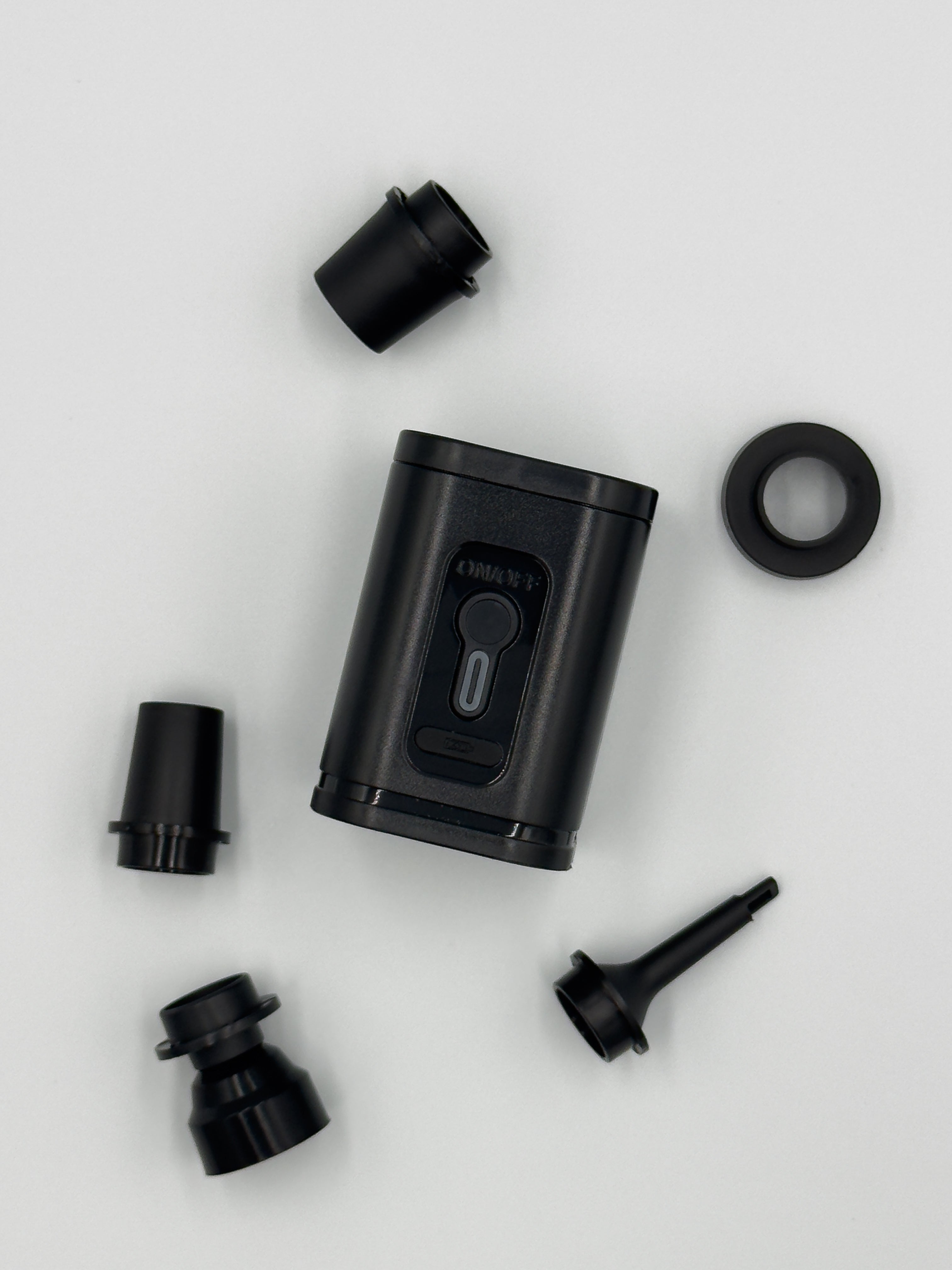 MINIVAC compact cordless vacuum pump with multiple black nozzle attachments for inflating and vacuum-sealing tasks.